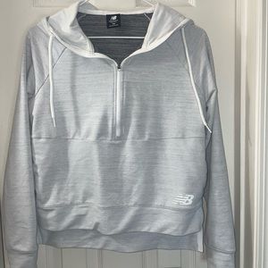 New Balance, XS quarter zip jacket. With pockets. Heather grey/white in color.